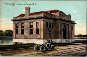 Vintage postcard of the Fulton Public Library taken in 1911, showing the original historic architecture.